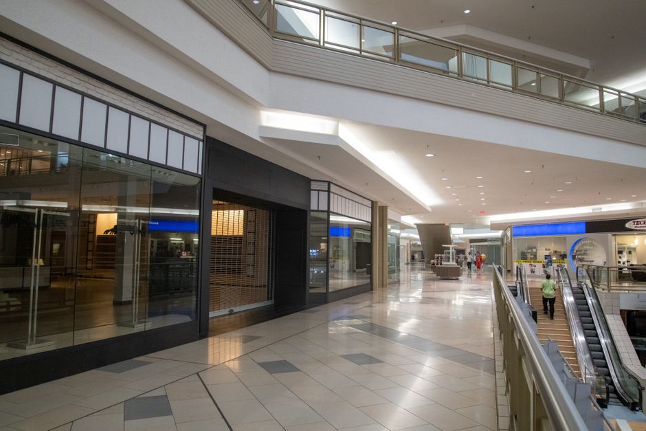 Modern commercial storefront with large glass panels in a Fort Worth business district