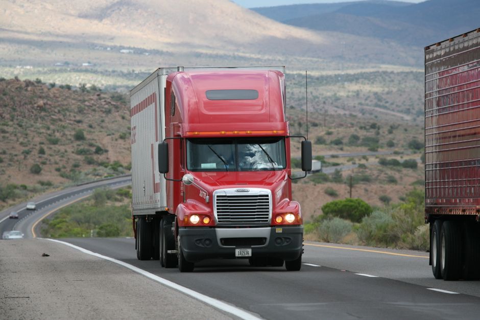 Full-size pickup truck driving on a Texas highway with a clear windshield